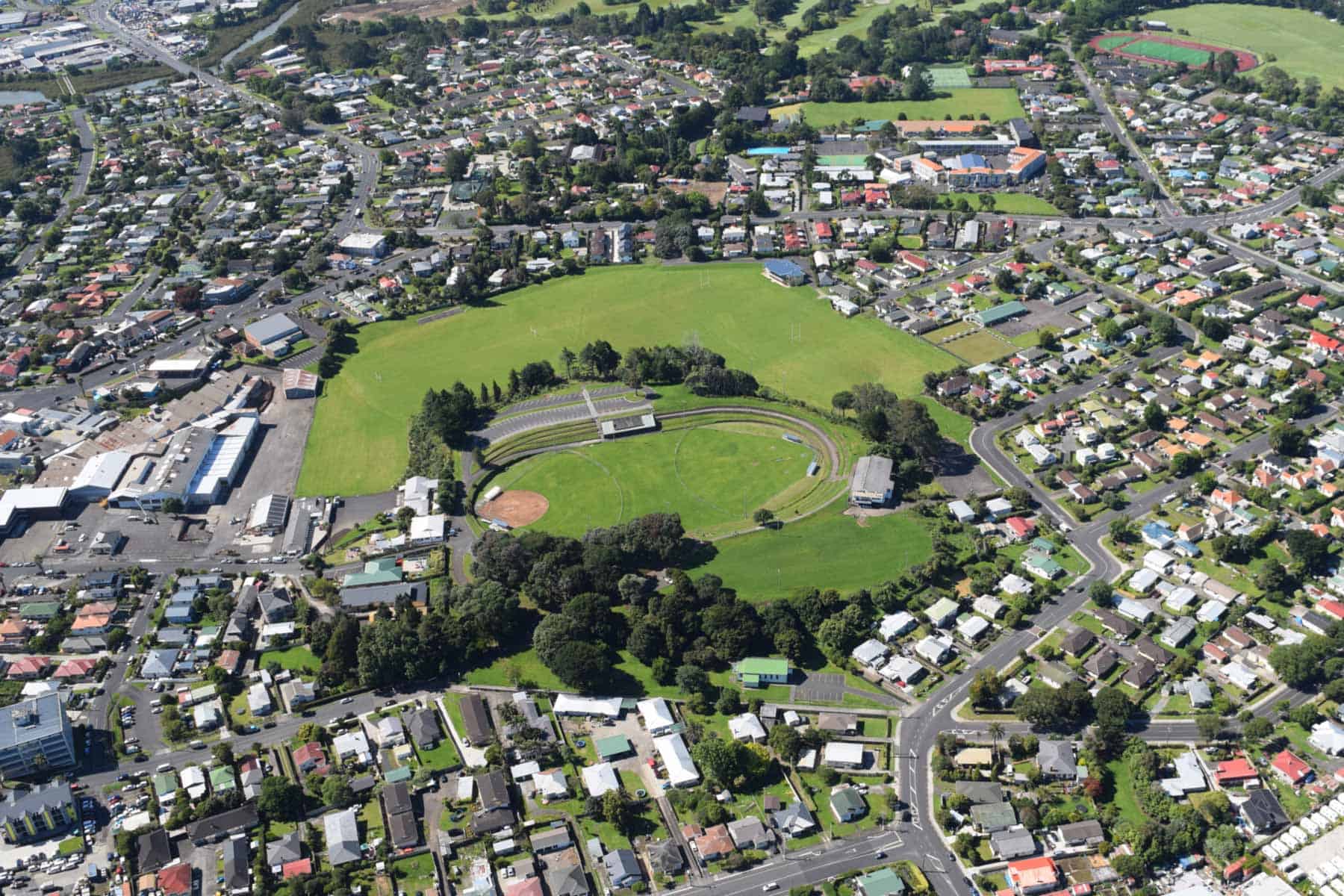 Aerial view of Sturges Park in Papatoetoe, showing the oval sports ground, grassy parkland and surrounding neighbourhood.