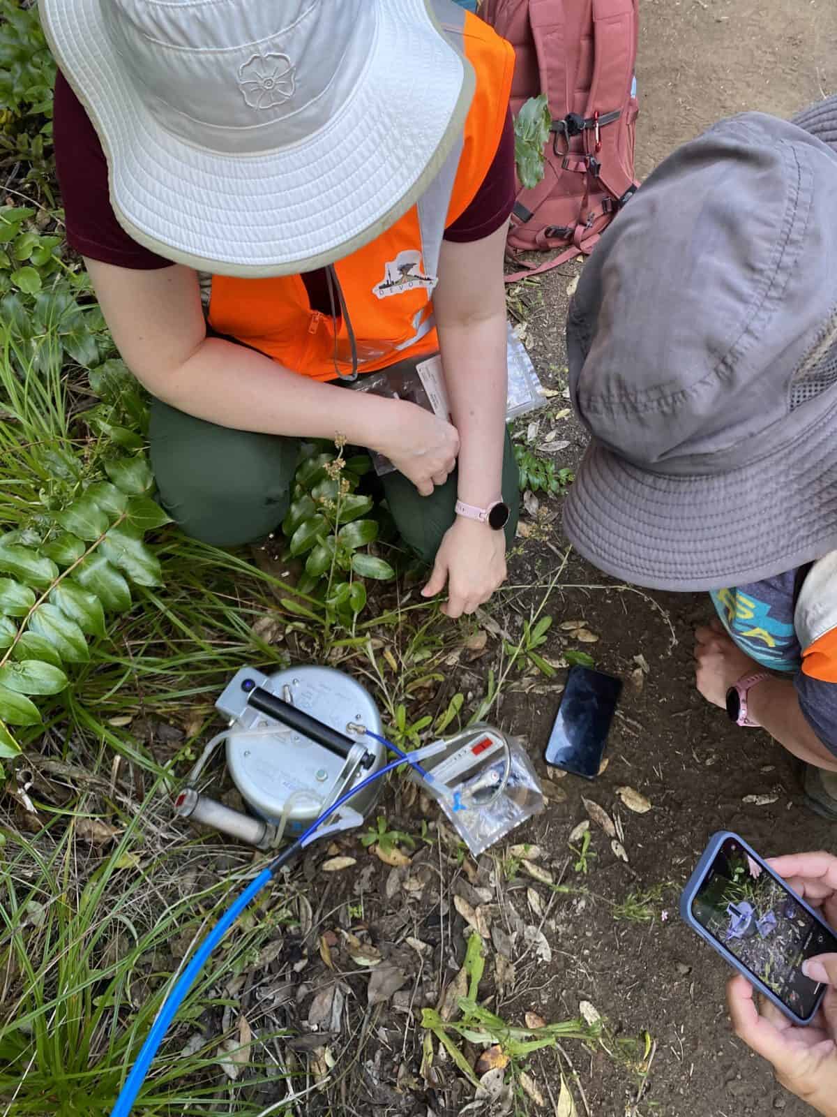 DEVORA researchers setting up field equipment on the ground at a research site
