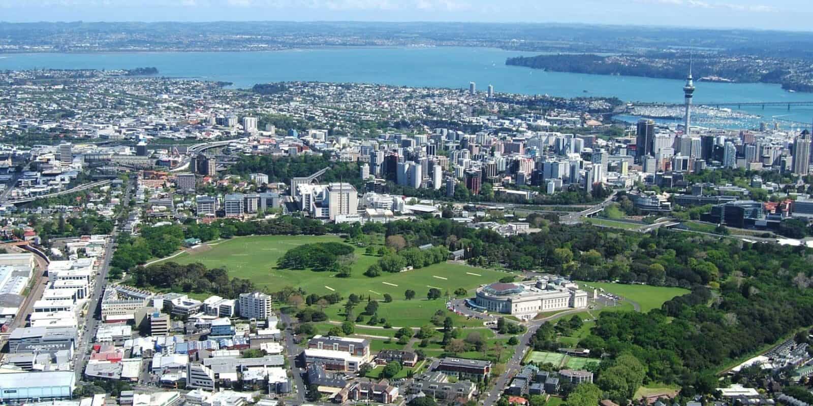 Aerial view of Pukekawa / Auckland Domain and the museum, with the city and harbour behind