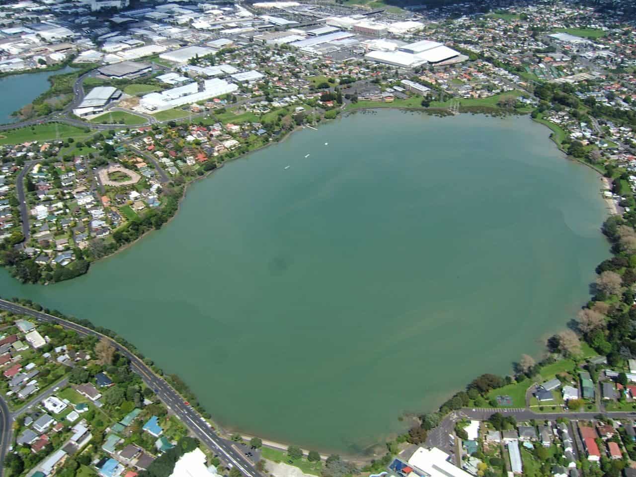 Aerial view of Te Kopua Kai a Hiku / Panmure Basin, a round explosion crater flooded by the sea and ringed by houses